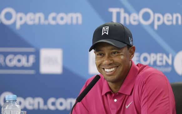 Tiger Woods of the US smiles during a press conference ahead of the British Open Golf Championship at Muirfield, Scotland.
