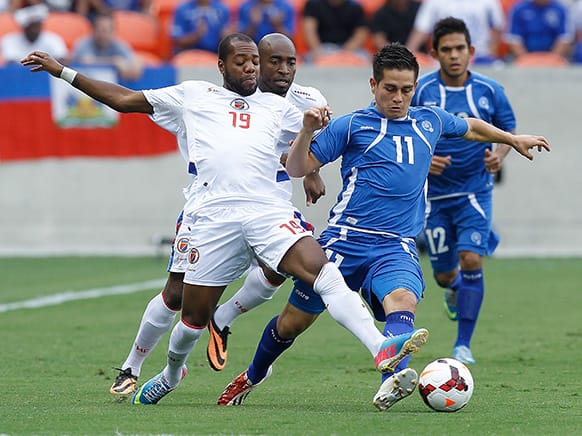 El Salvador`s Rodolfo Zelaya (11) battles with Haiti`s Gerson Mayen Villavicencio during the first half of a CONCACAF Gold Cup soccer match, in Houston.