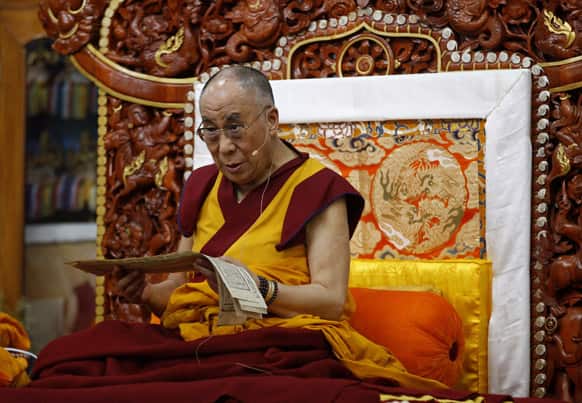 Tibetan spiritual leader the Dalai Lama sits on a throne as he delivers a religious sermon at the Gyudmed Tantric Monastery in Gurupura 212 kilometers (132 miles) southwest of Bangalore.