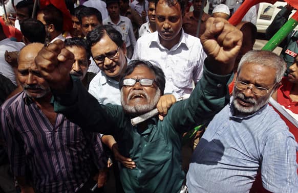 Bangladeshi activists shout slogans as they protest against the verdict of former Jamaat-e-Islami leader Ghulam Azam in Dhaka, Bangladesh.