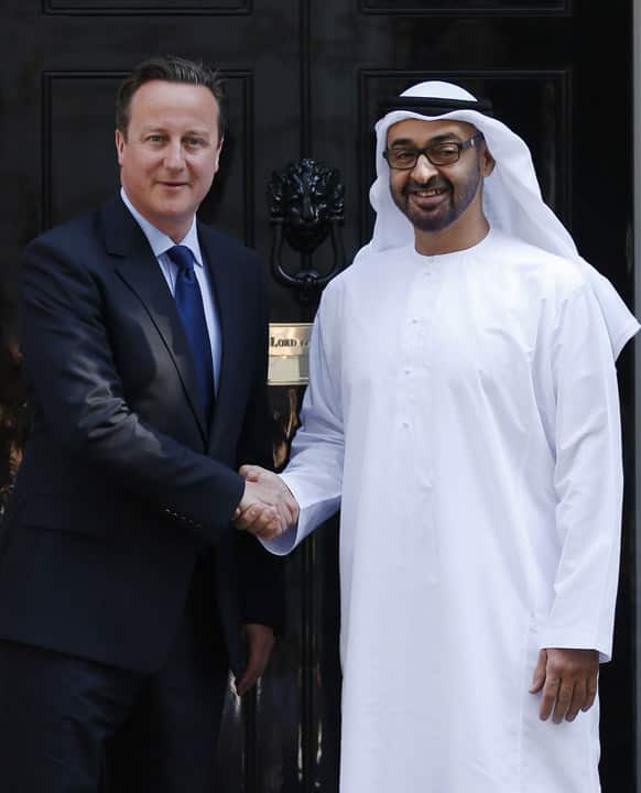 Crown Prince of Abu Dhabi, Sheikh Mohamed bin Zayed Al Nahyan, right, meets with British Prime Minister David Cameron as he arrives for a meeting at 10 Downing Street in London.