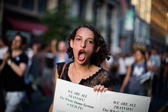 A demonstrator chants during a march in New York, against the acquittal of neighborhood watch member George Zimmerman in the killing of 17-year-old Trayvon Martin in Florida.