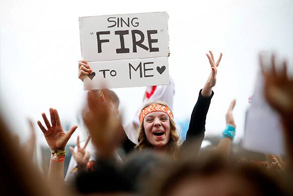 A fan of British musician Jake Bugg cheers during Bugg`s concert at the Optimus Alive music festival in Lisbon, Portugal.