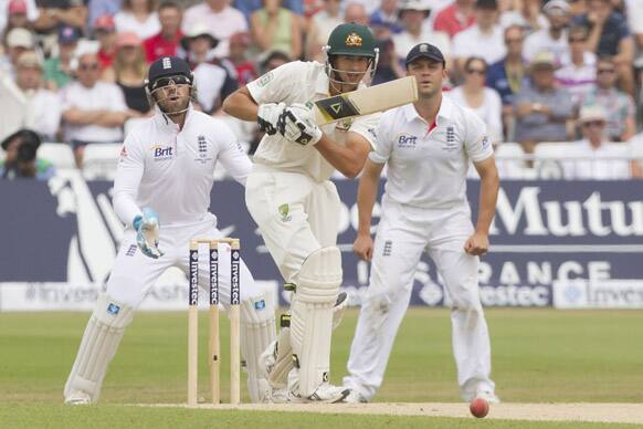 Australia`s Ashton Agar, centre, plays a shot off the bowling of England`s Graeme Swann on the final day of the opening Ashes series cricket match at Trent Bridge cricket ground, Nottingham, England.