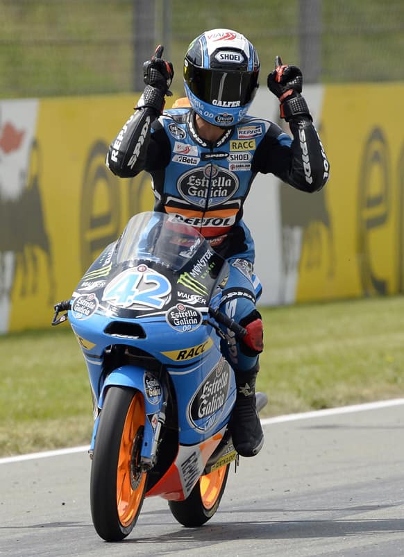 KTM rider Alex Rins of Spain celebrates after winning the Moto3 at the Grand Prix of Germany at the Sachsenring circuit in Hohenstein-Ernstthal, near the city of Chemnitz, Germany.