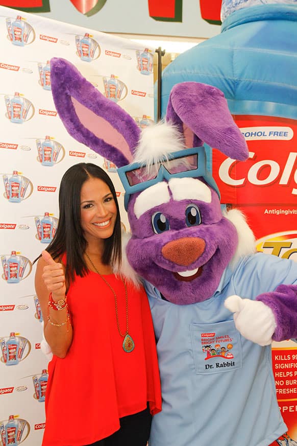 Karla Martinez poses with Dr. Rabbit at an event organized by Colgate-Palmolive and the Hispanic Dental Association to encourage Hispanics to take charge of their oral health in Houston.