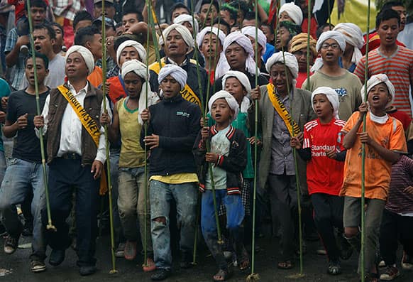Jaintia tribesmen participate in the Behdienkhlam festival celebrations in Jowai, in the northeastern Indian state of Meghalaya.