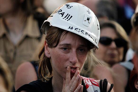 A woman gestures during the protest by women miners from the Asturias, Leon and Aragon regions, against the Government policies on the sector including huge cuts in subsidies since 2012 and the rising unemployment in Madrid, Spain.