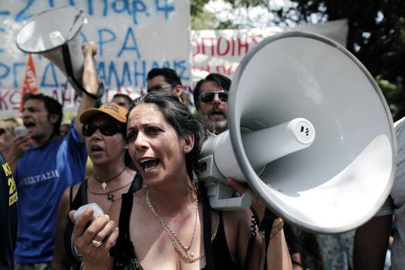 Municipality workers chant slogans during a protest, against new austerity cuts that will affect thousands of public sector workers, in Athens.