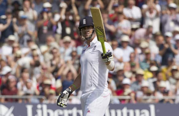 England`s Kevin Pietersen raises his bat as he reaches 50 on the third day of the opening Ashes series cricket match against Australia at Trent Bridge cricket ground, Nottingham, England.