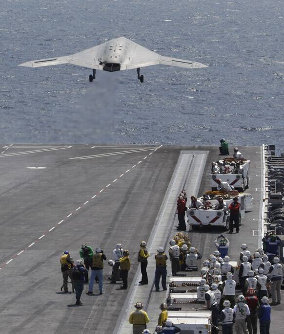 A X47-B Navy Drone is launched from the deck of the nuclear aircraft carrier USS George H.W. Bush off the Coast of Virginia.