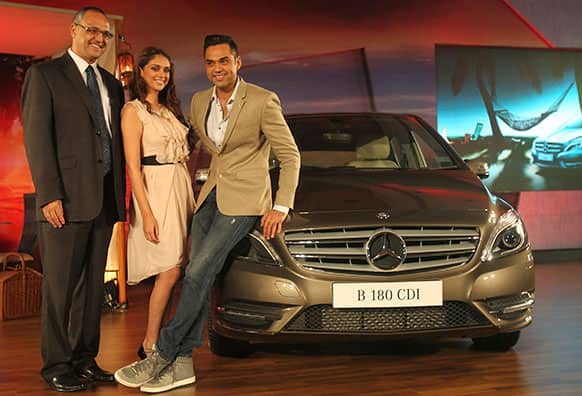 From left, Mercedes Benz India Managing Director and CEO Eberhard Kern, Bollywood actors Aditi Rao and Abhay Deol pose with a Mercedes Benz New B-class diesel car during its launch in Mumbai, India. The car retails at US$37,856 in Mumbai.