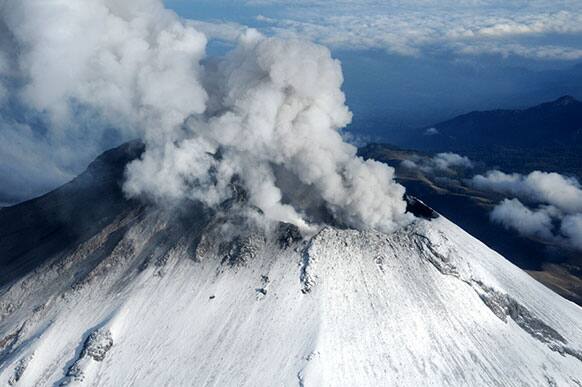 Steam and ash rise from the crater of the Popocatepetl volcano on the outskirts of Mexico City as seen during an over flight.