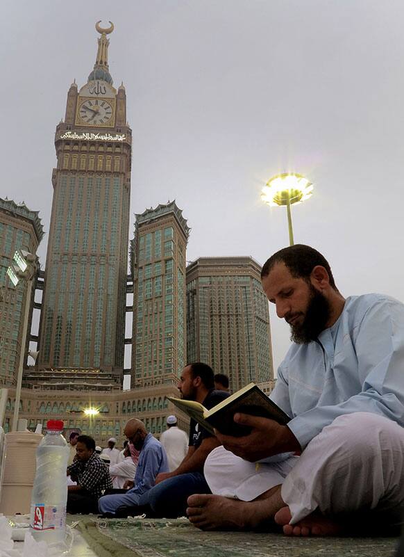 A worshipper reads Islam`s holy book Quran at the Grand Mosque in the holy Muslim city of Mecca, Saudi Arabia.