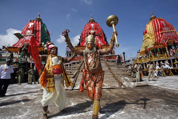 Traditional dancers of the Shree Jagannath temple dance during the annual Rath Yatra or chariot procession of Lord Jagannath in Puri, 60 kilometers (37 miles) from the eastern Indian city of Bhubaneswar.
