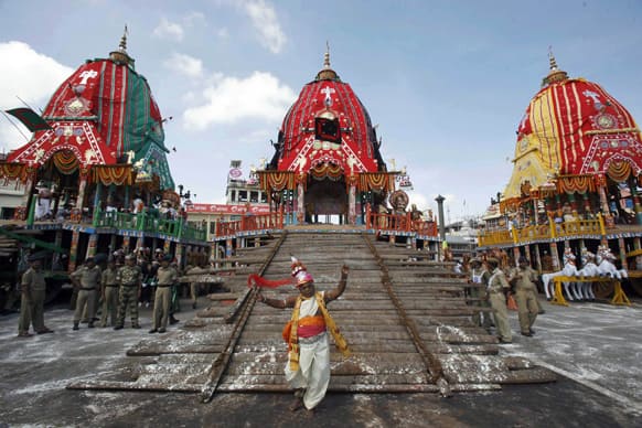 A traditional dancer performs during the annual Rath Yatra or chariot procession of Lord Jagannath in Puri, 60 kilometers (37 miles) from the eastern Indian city of Bhubaneswar.