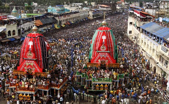 Devotees throng around the chariot of Lord Jagannath and his sister Subhadra during the annual Rath Yatra or chariot procession in Puri, 60 kilometers (37 miles) from the eastern Indian city of Bhubaneswar.