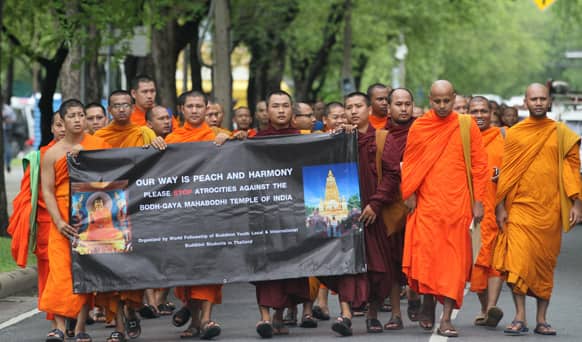 Buddhist monks gather outside the United Nations office in Bangkok, Thailand, to demand peace after a series of blasts at Bodh Gaya in eastern India.