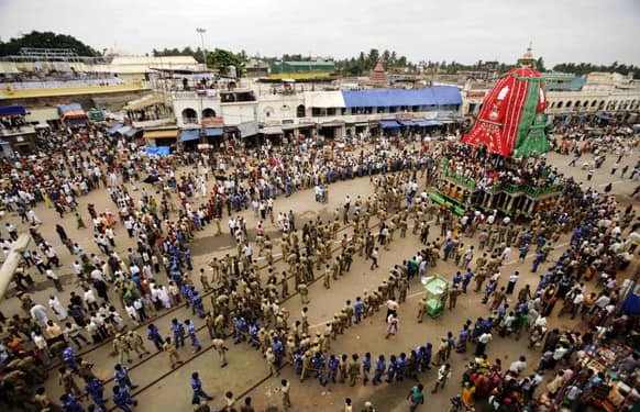 FILE PHOTO: Police forces pull a chariot to set in front of the Lord Jagannath temple on the eve of the 135th annual Rath Yatra, or Chariot procession, at Puri, 65 kilometers (40 miles) away from the eastern Indian city Bhubaneswar.