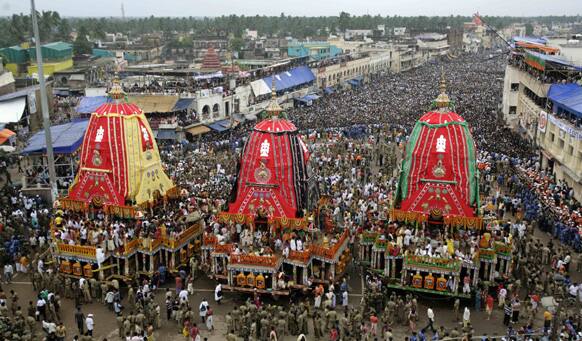 FILE PHOTO: Devotees throng around the chariots as they wait to pull them during the annual Hindu festival