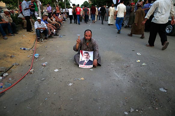 Supporters of ousted President Mohammed Morsi protest at the Republican Guard building in Nasr City, Cairo, Egypt.
