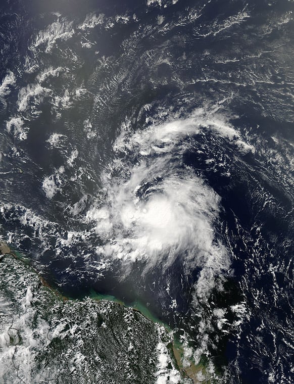 This image provided by NASA shows Tropical Storm Chantal taken at 1 p.m. EDT Monday July 8, 2013. The fast-moving tropical storm raced toward the small islands of the Lesser Antilles on Tuesday, with residents of St. Lucia shuttering schools and preparing to close the island`s two airports as it neared.