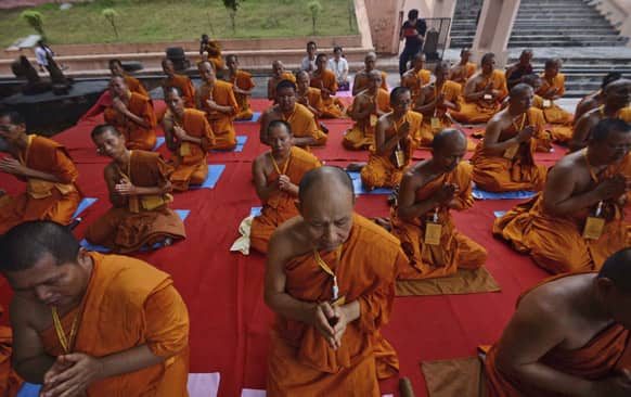 Buddhist monks from Thailand offer prayers at the Mahabodhi or the Great Awakening Temple, in Bodh Gaya.