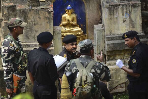 National Security Guards inspect the site of a blast at the Mahabodhi Temple or the great Awakening Temple complex, in Bodhgaya, about 130 kilometers (80 miles) south of Patna, the capital of the eastern Indian state of Bihar.