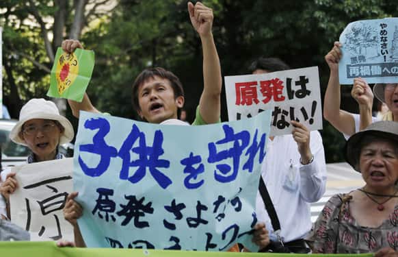 Protesters shout slogans during an anti-nuclear rally in front of the Nuclear Regulation Authority (NRA) in Tokyo.