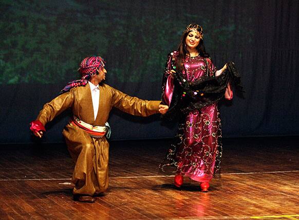 Dancers wearing traditional Iraqi folk costumes perform during a celebration of the Iraqi capital becoming this year`s Arab Capital of Culture in Baghdad.