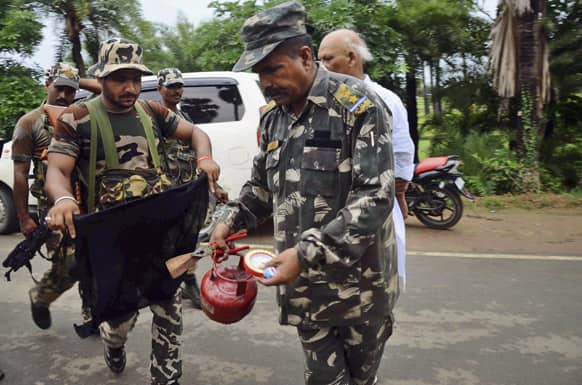 A bomb squad member defuses a suspected timer fitted device at Bodhgaya, about 130 kilometers (80 miles) south of Patna, the capital of the eastern Indian state of Bihar.