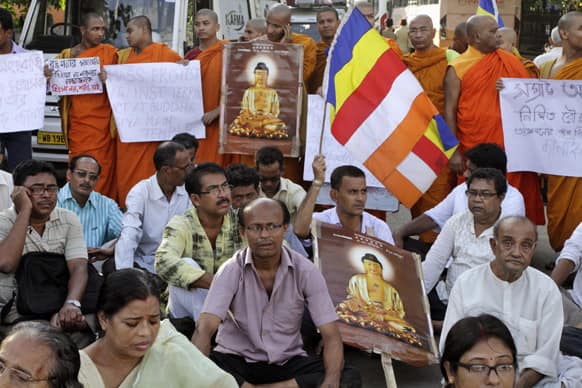 Indian Buddhists and monks stage a silent protest against the series of blasts in Bodhgaya, in Kolkata.