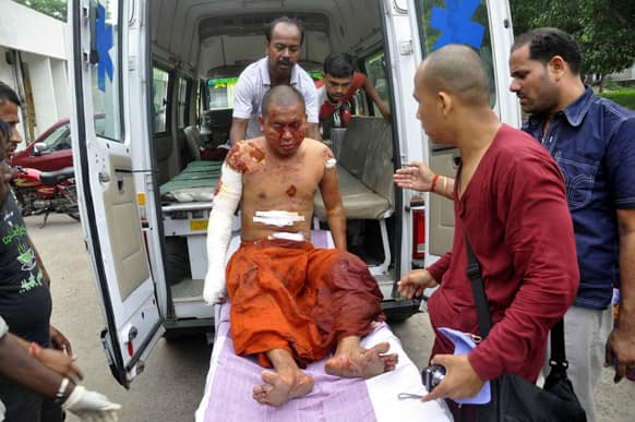 A Buddhist monk is carried on a stretcher for treatment after he was injured in an explosion in Bodhgaya, about 130 kilometers (80 miles) south of Patna, the capital of the eastern Indian state of Bihar.