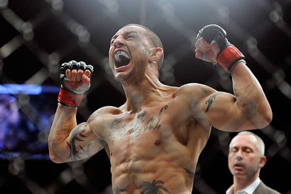 Cub Swanson reacts after defeating Dennis Siver during the third round of their UFC 162 mixed martial arts featherweight bout at the MGM Grand Garden Arena in Las Vegas.