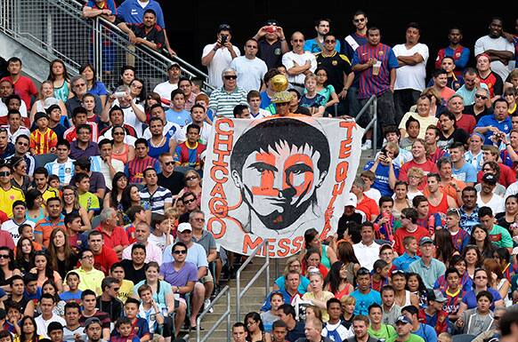 Fans cheer for Messi`s Friends` Lionel Messi against the Rest of the World during the first half of the Messi and Friends charity soccer exhibition in Chicago.