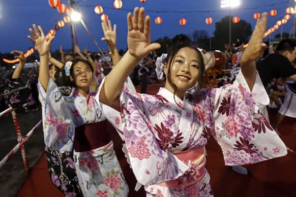 Japanese girls living in Malaysia wearing traditional yukatas dance during the 37th Bon Odori festival in Shah Alam, outside Kuala Lumpur, Malaysia.