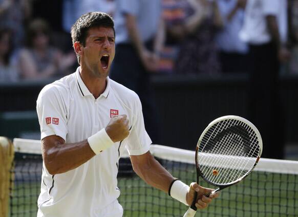 Novak Djokovic of Serbia reacts after defeating Juan Martin Del Potro of Argentina in their Men`s singles semifinal match at the All England Lawn Tennis Championships in Wimbledon, London.