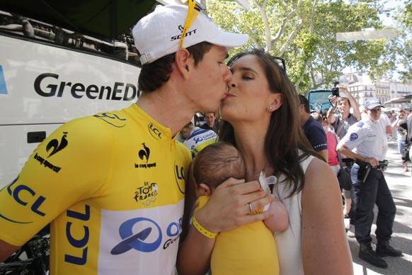 Daryl Impey of South Africa, wearing the overall leader`s yellow jersey, kisses his wife Alexandra prior to the start of the seventh stage of the Tour de France cycling race over 205.5 kilometers (128.5 miles) with start in Montpellier and finish in Albi, southern France.