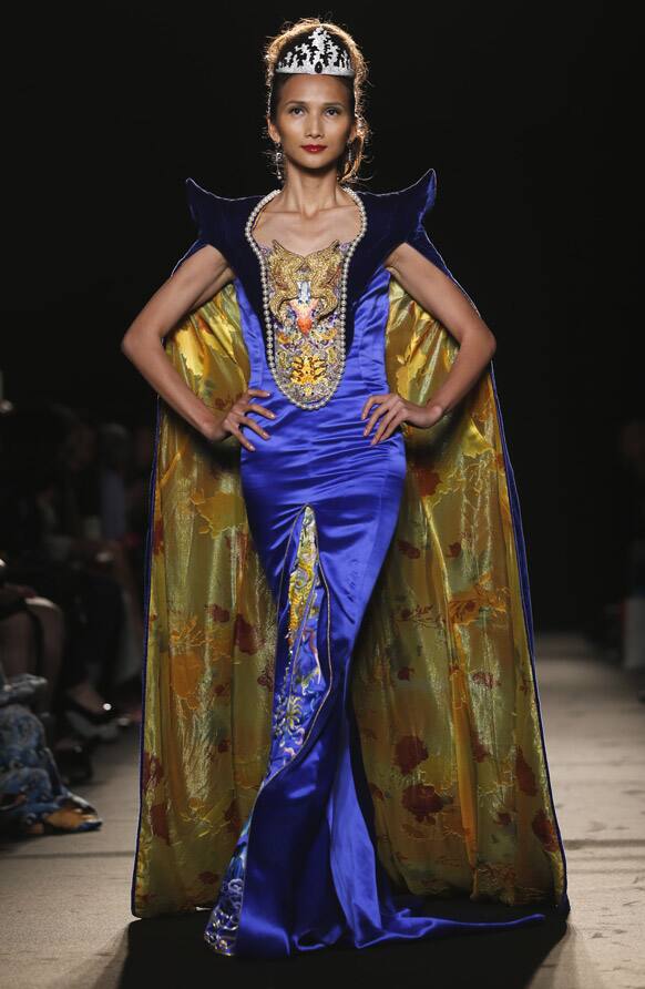 A model wears a creation by Chinese fashion designer Laurence Xu during her Women`s Fall Winter 2013 haute couture fashion collection in Paris, France.