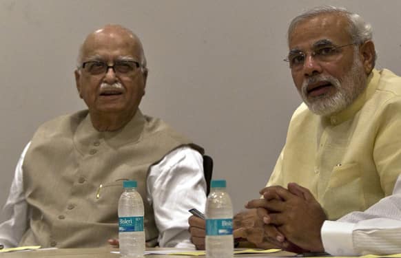 Gujarat Chief Minister Narendra Modi and BJP Leader L.K. Advani attend the party`s parliamentary board meeting in New Delhi.
