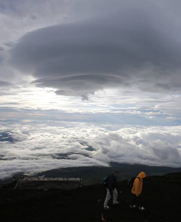 Climbers go up Mount Fuji in Fujiyoshida city, Yamanashi prefecture, Japan. Japan`s most iconic landmark, the 3,776-meter-tall Mount Fuji, was selected as a World Heritage site in June.
