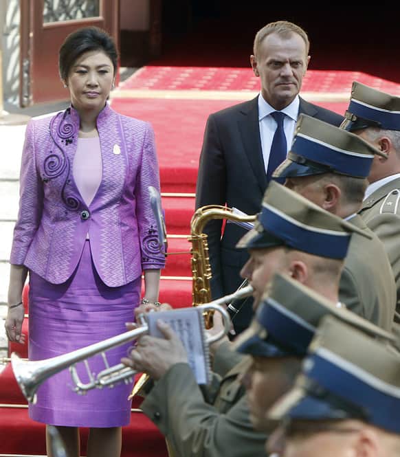 Polish Prime Minister Donald Tusk and his counterpart of Thailand Yingluck Shinawatra attend a welcoming ceremony in Warsaw, Poland.