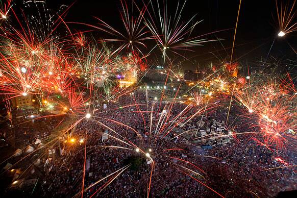 Fireworks light the sky opponents of Egypt`s Islamist President Mohammed Morsi celebrate in Tahrir Square in Cairo, Egypt.