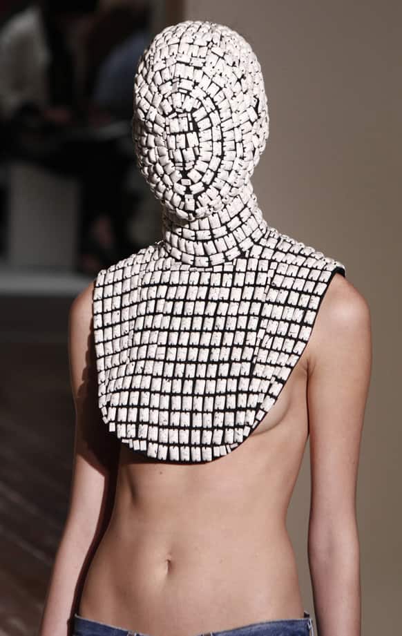 A model wears a creation for Maison Martin Margiela`s Haute Couture Fall-Winter 2013-2014 collection presented in Paris.