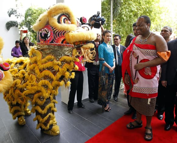 Swaziland`s King Mswati III, right, watches a lion dance performance as he visits to Taylor`s University in Subang Jaya, near Kuala Lumpur, Malaysia. The Swaziland`s King is on a five-day working visit to Malaysia.