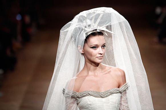 A model wears a wedding dress by Venezuelan fashion designer Oscar Carvallo as part of his Haute Couture Fall-Winter 2013-2014 collection.