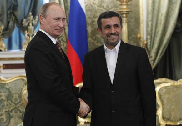 Russian President Vladimir Putin and Iranian President Mahmoud Ahmadinejad shake hands during their meeting in the Kremlin in Moscow.