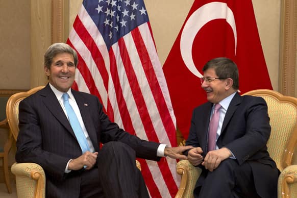 US Secretary of State John Kerry, meets with Turkey`s Foreign Minister Ahmet Davutoglu before attending ASEAN security meetings in Bandar Seri Begawan, Brunei. Kerry is expected to start the return to Washington Tuesday afternoon.