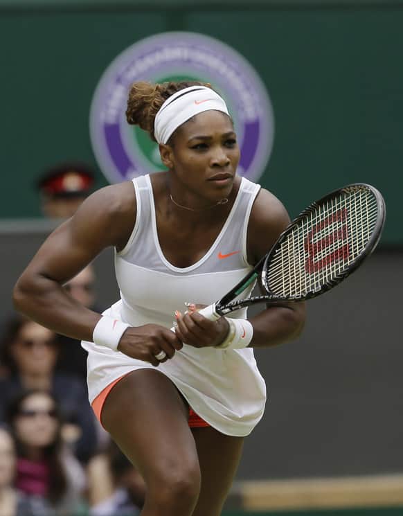 Serena Williams of the United States runs to return to Sabine Lisicki of Germany during a Women`s singles match at the All England Lawn Tennis Championships in Wimbledon.