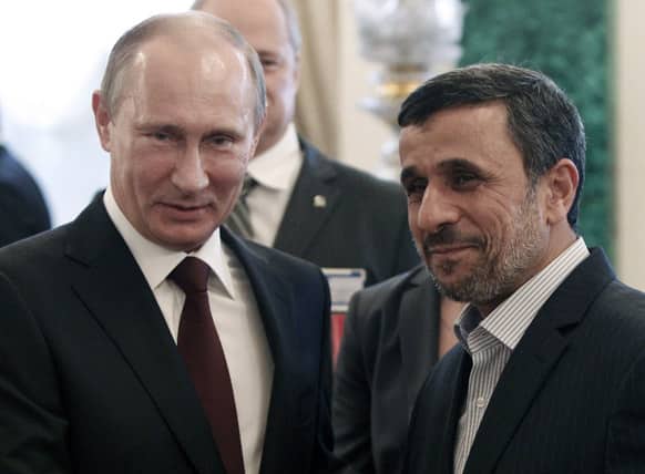 Russia`s President Vladimir Putin, left, meets with his Iranian counterpart Mahmoud Ahmadinejad, right, before the Gas Exporting Countries Forum (GECF) at the Kremlin in Moscow.